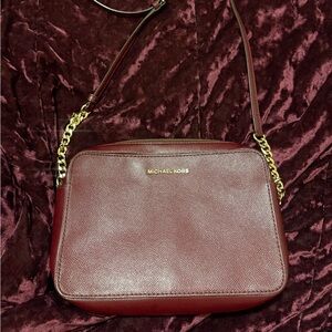 Maroon Michael Kors jet set crossbody